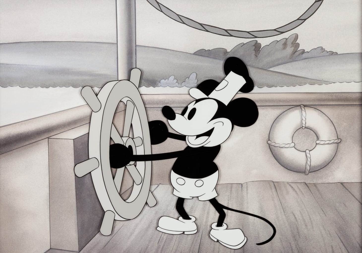 A still of Mickey Mouse piloting a steamboat from the animated movie Steamboat Willie. 